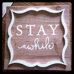 “Stay awhile” sign
